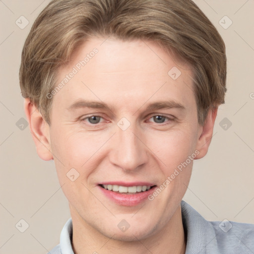 Joyful white adult male with short  brown hair and grey eyes