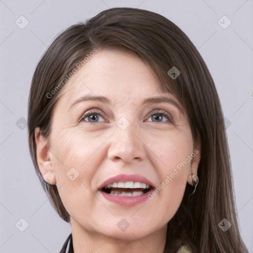 Joyful white adult female with medium  brown hair and grey eyes