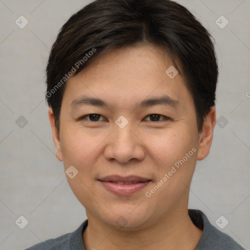 Joyful asian young-adult male with short  brown hair and brown eyes