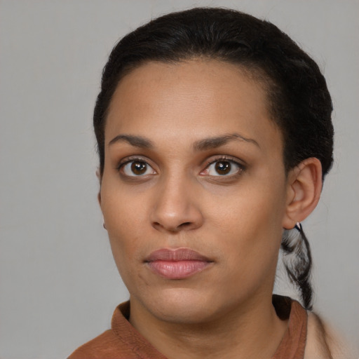Neutral black young-adult female with short  brown hair and brown eyes