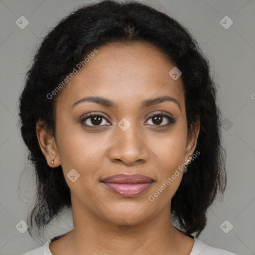 Joyful black young-adult female with medium  brown hair and brown eyes