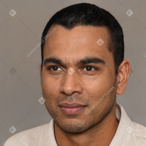 Joyful latino young-adult male with short  black hair and brown eyes