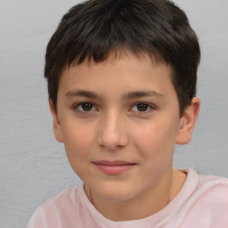 Joyful white child male with short  brown hair and brown eyes