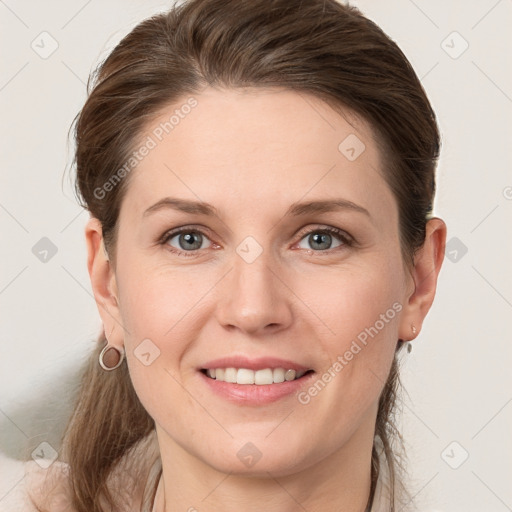 Joyful white young-adult female with medium  brown hair and grey eyes