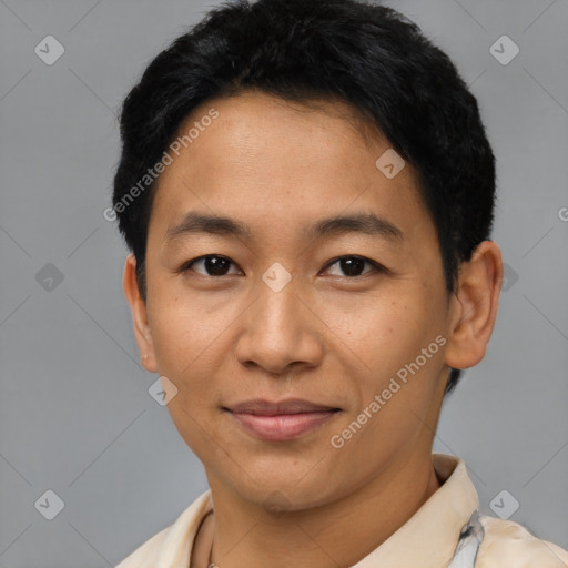 Joyful asian young-adult male with short  black hair and brown eyes