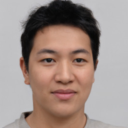 Joyful asian young-adult male with short  brown hair and brown eyes