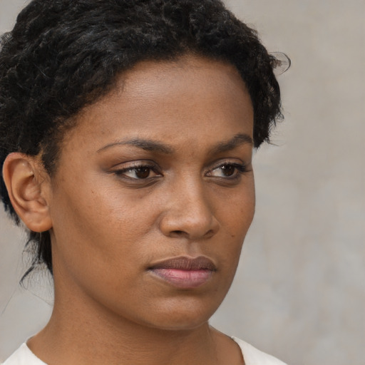 Neutral black young-adult female with short  brown hair and brown eyes