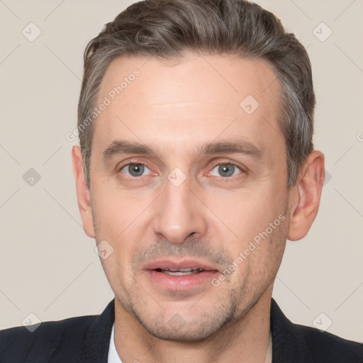 Joyful white adult male with short  brown hair and brown eyes