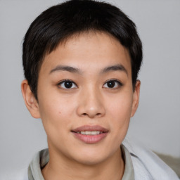 Joyful asian young-adult female with short  brown hair and brown eyes