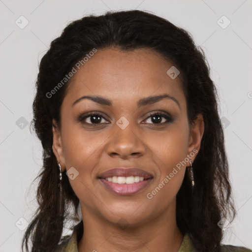 Joyful black young-adult female with long  brown hair and brown eyes