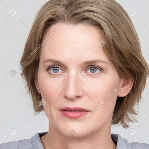 Joyful white young-adult female with medium  brown hair and blue eyes