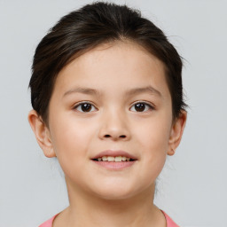 Joyful white child female with short  brown hair and brown eyes