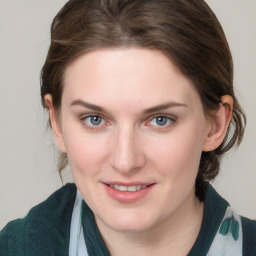 Joyful white young-adult female with medium  brown hair and blue eyes