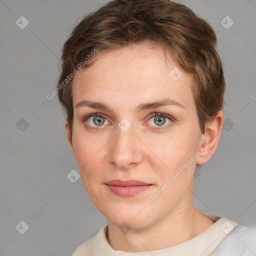 Joyful white young-adult female with short  brown hair and grey eyes