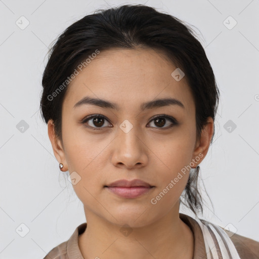 Joyful latino young-adult female with medium  brown hair and brown eyes