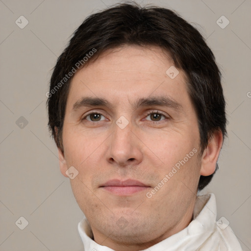 Joyful white adult male with short  brown hair and brown eyes