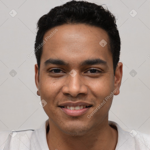 Joyful latino young-adult male with short  black hair and brown eyes