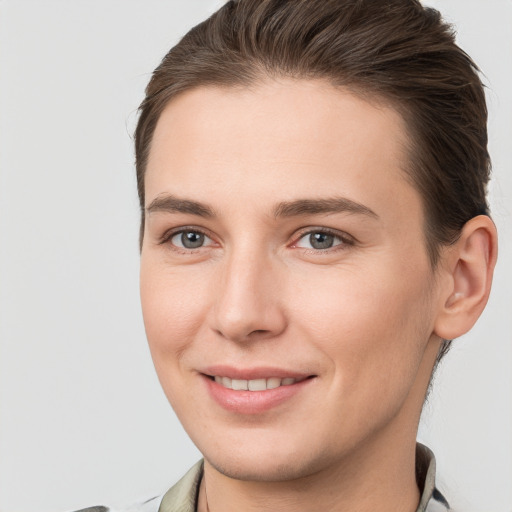 Joyful white young-adult female with short  brown hair and brown eyes