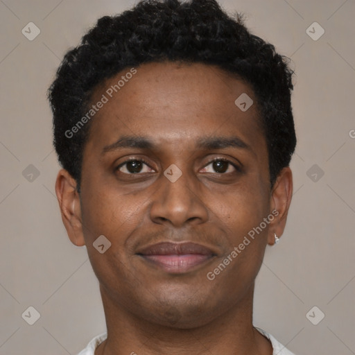 Joyful black young-adult male with short  brown hair and brown eyes
