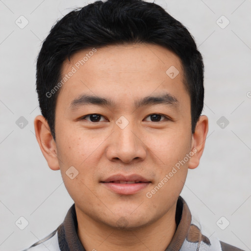 Joyful asian young-adult male with short  black hair and brown eyes