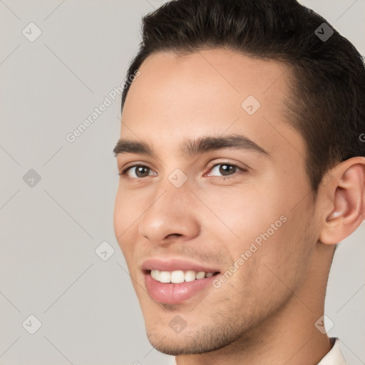 Joyful white young-adult male with short  brown hair and brown eyes