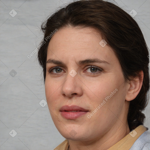 Joyful white adult female with medium  brown hair and brown eyes