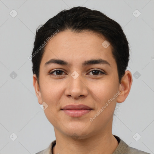 Joyful latino young-adult female with short  black hair and brown eyes