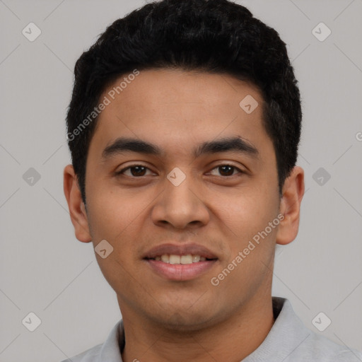 Joyful latino young-adult male with short  black hair and brown eyes