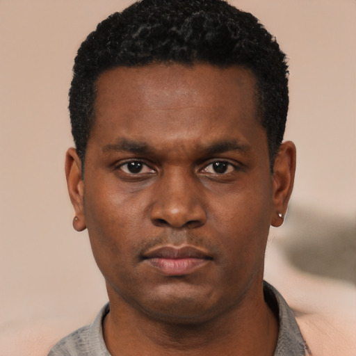 Neutral black young-adult male with short  black hair and brown eyes