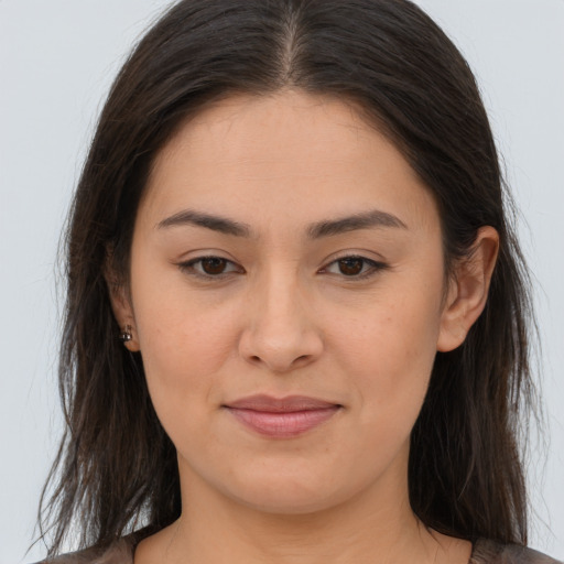 Joyful asian young-adult female with long  brown hair and brown eyes