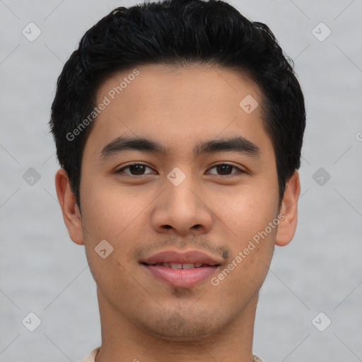 Joyful asian young-adult male with short  black hair and brown eyes