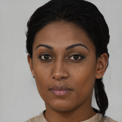 Neutral black young-adult female with medium  black hair and brown eyes