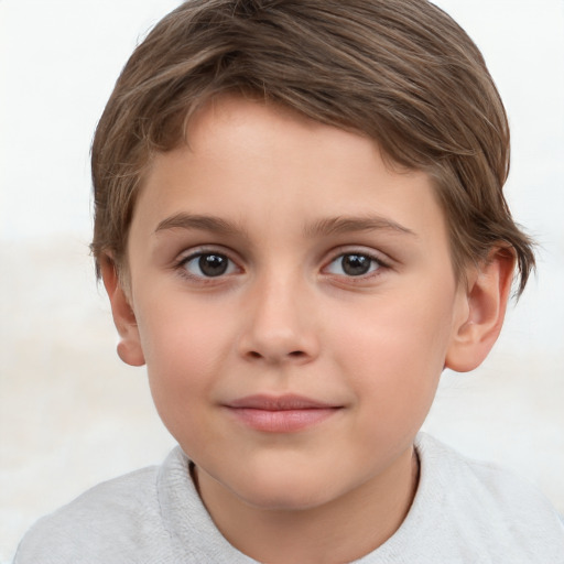 Joyful white child male with short  brown hair and brown eyes