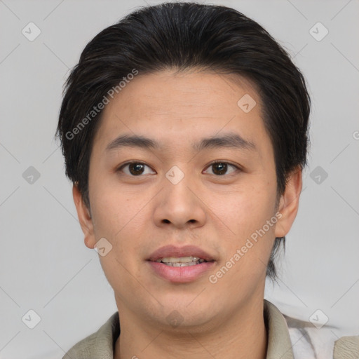 Joyful asian young-adult male with short  brown hair and brown eyes