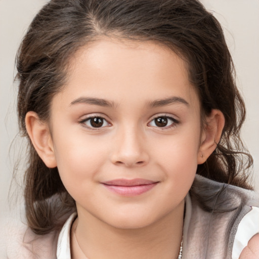 Joyful white child female with medium  brown hair and brown eyes