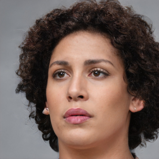 Neutral white young-adult female with medium  brown hair and brown eyes