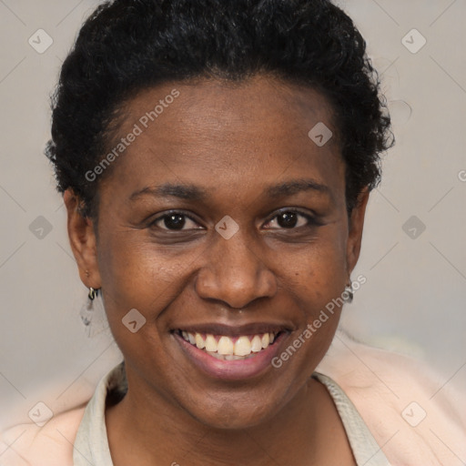 Joyful black young-adult female with short  brown hair and brown eyes