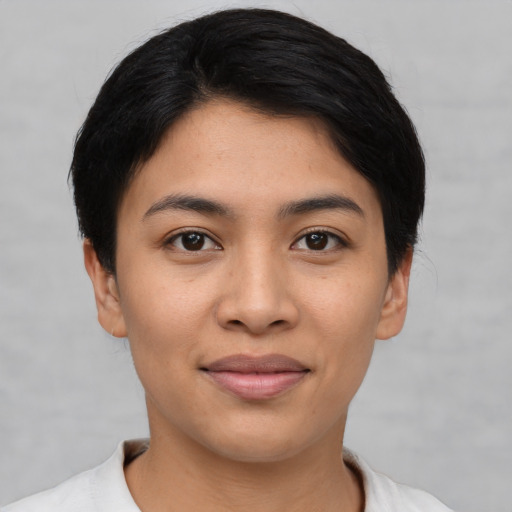 Joyful asian young-adult female with short  black hair and brown eyes