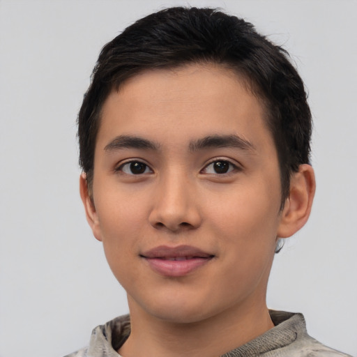 Joyful asian young-adult male with short  black hair and brown eyes