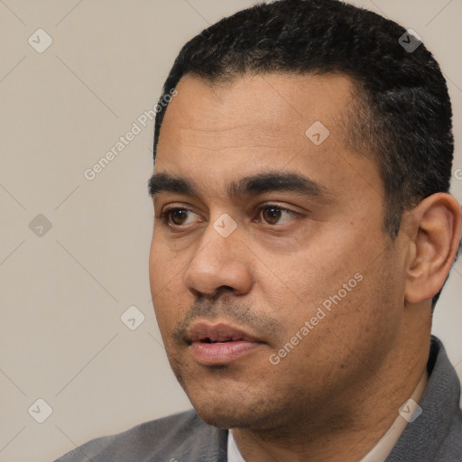 Neutral latino young-adult male with short  black hair and brown eyes