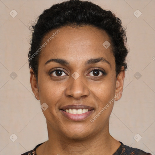 Joyful black young-adult female with short  black hair and brown eyes