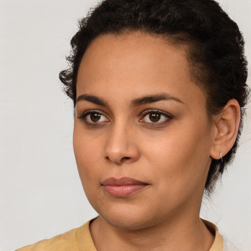 Neutral latino young-adult female with short  brown hair and brown eyes