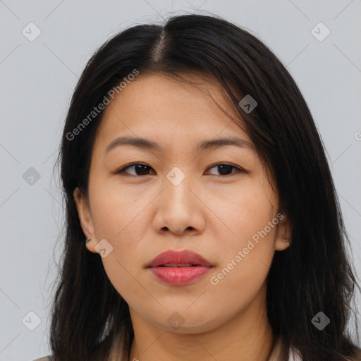 Joyful asian young-adult female with long  brown hair and brown eyes