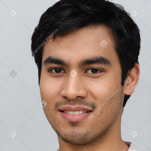 Joyful asian young-adult male with short  black hair and brown eyes