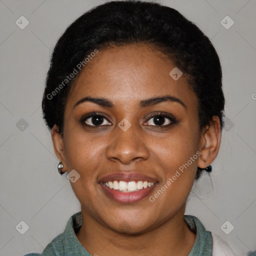 Joyful black young-adult female with short  black hair and brown eyes