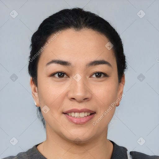 Joyful asian young-adult female with short  black hair and brown eyes