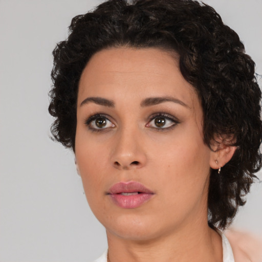Neutral latino young-adult female with medium  brown hair and brown eyes