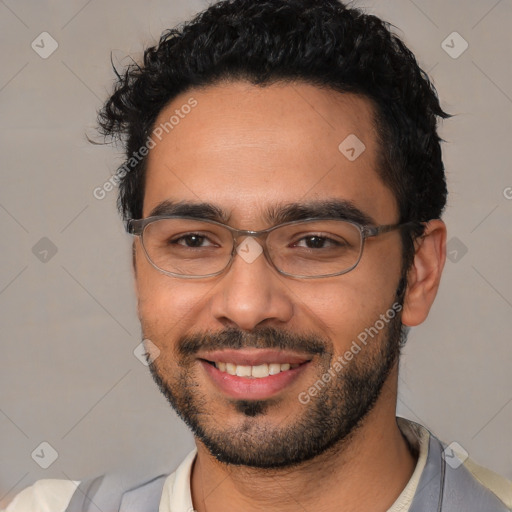 Joyful white young-adult male with short  black hair and brown eyes