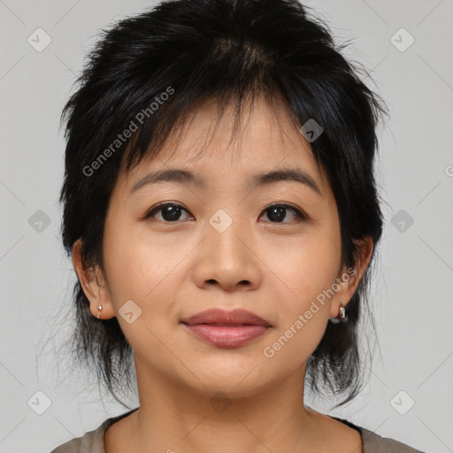 Joyful asian young-adult female with medium  black hair and brown eyes