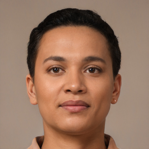 Joyful latino young-adult female with short  black hair and brown eyes